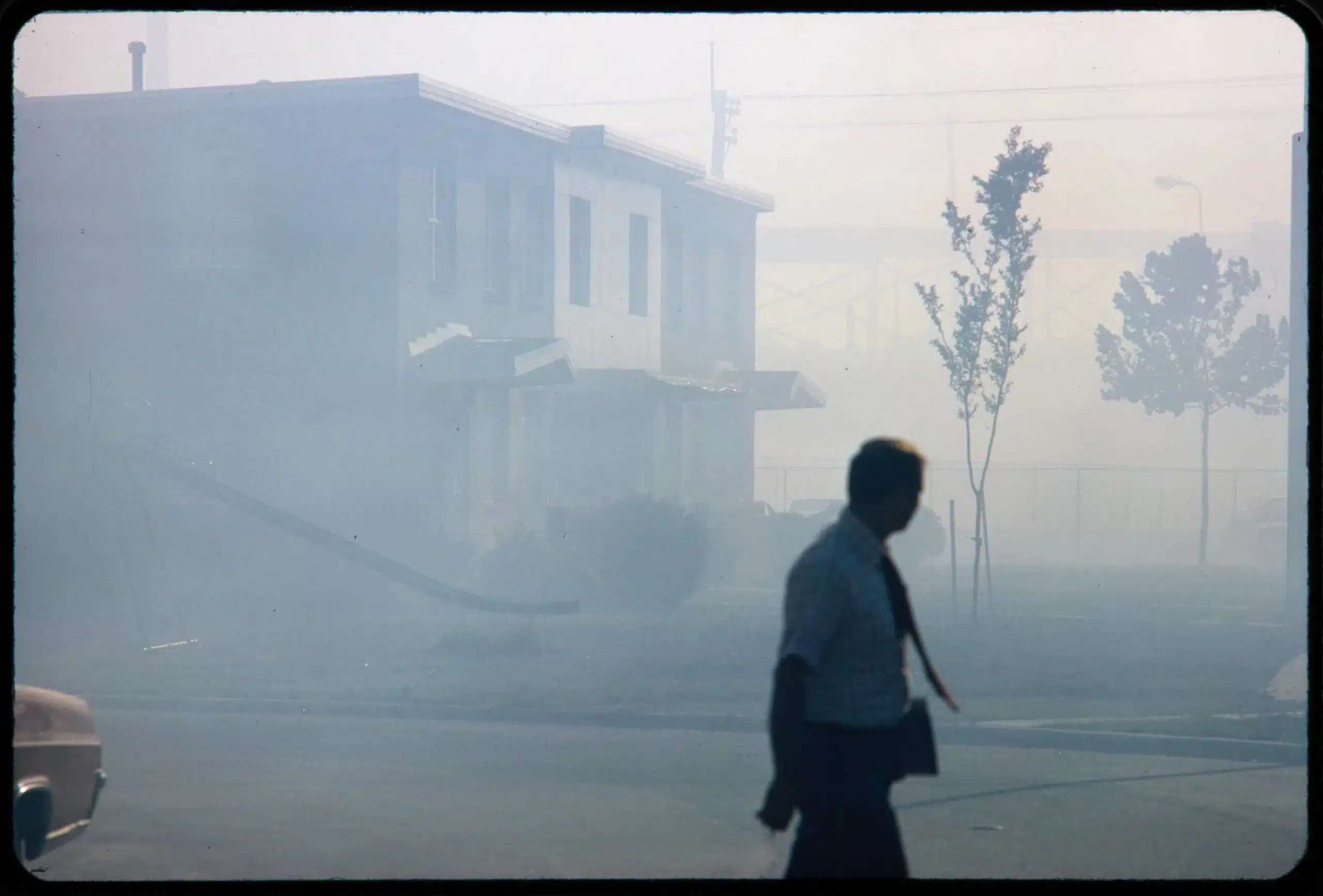 Industrial smog blacks out homes near the North Birmingham Pipe Plant, Alabama, 1972. LeRoy Wilson for EPA’s Documerica Project.